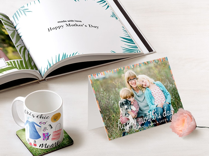 Mother's Day photo book, card and mug on a table