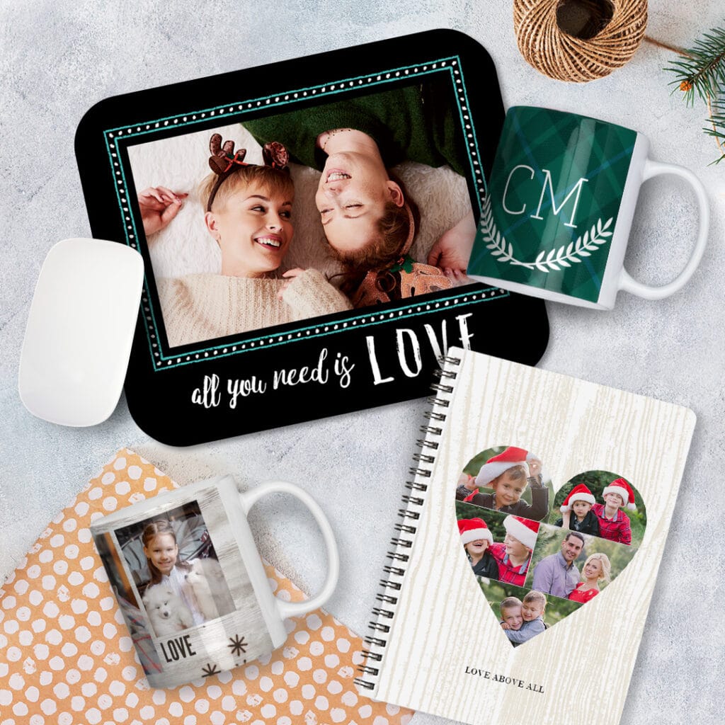 a personalised mousemat, 2 Christmas mugs and a spiral notebook with images of a lovely family