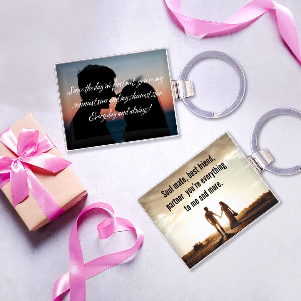 Two key rings by a gift and pink ribbons